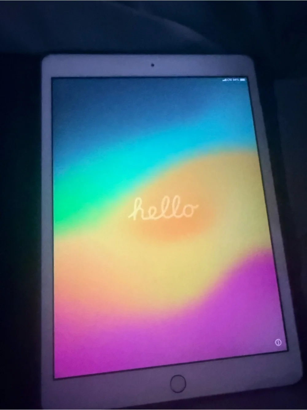 Apple White Tablet with Rainbow Hello Display